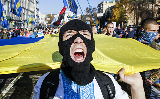 Activists and supporters of the All-Ukrainian Union Svoboda (Freedom) Party take part in a procession to mark the Day of Ukrainian Cossacks in Kiev