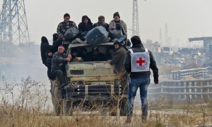 Syrians are evacuated from a rebel-held area of Aleppo towards rebel-held territory in the west of Aleppo's province on December 16, 2016. Russia announced it was negotiating with the Syrian opposition and seeking a nationwide ceasefire, as the evacuation of civilians and fighters from the last rebel-held parts of Aleppo entered a second day. The Syrian Observatory for Human Rights, a Britain-based monitor of the war, estimated some 8,500 people had left so far, including around 3,000 rebel fighters. Syrian state media reported a figure of around 8,000. / AFP PHOTO / STRINGER